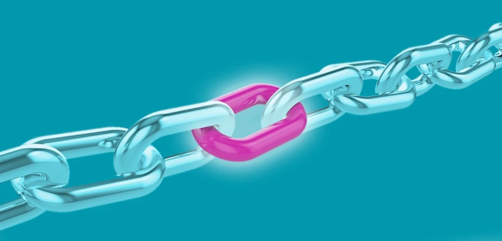 A chain with a glowing pink link in the middle