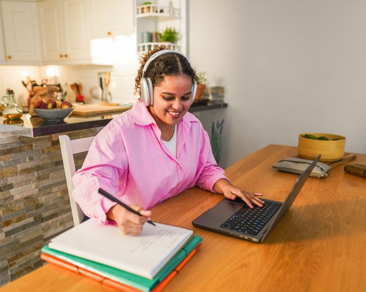 African girl using laptop computer from home