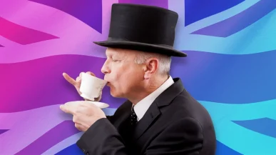 man in a top hat drinking tea in front of the Union Jack flag