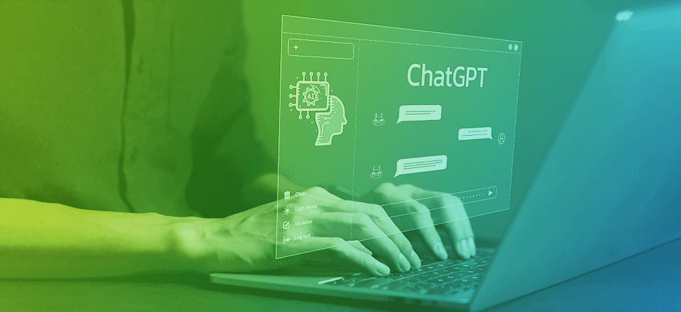 A person typing on a laptop showing a ChatGPT window.