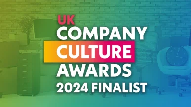 The logo for the UK Company Culture Awards with a collection of office furniture in the background