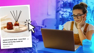 A woman using a laptop with a Pinterest ad mockup