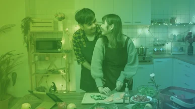 A couple cooking a Valentine's Day dinner together in their kitchen