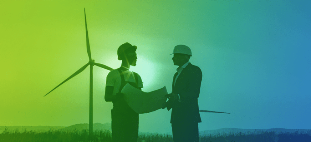 two people talking in front of wind turbine