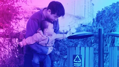 man with child in park