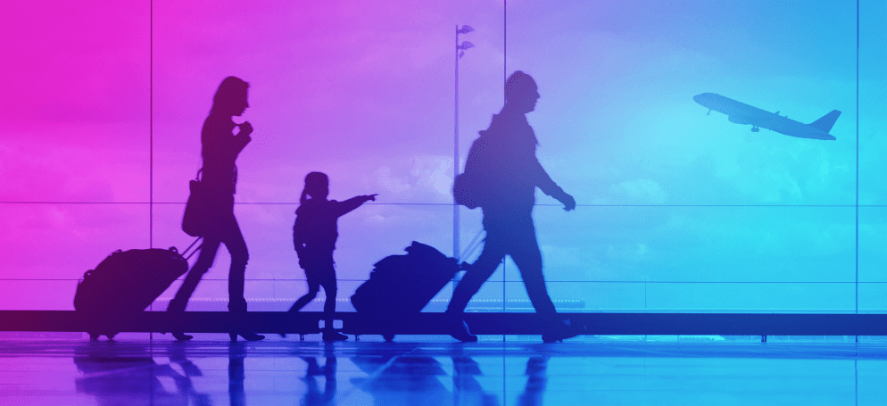 people at airport with suitcase