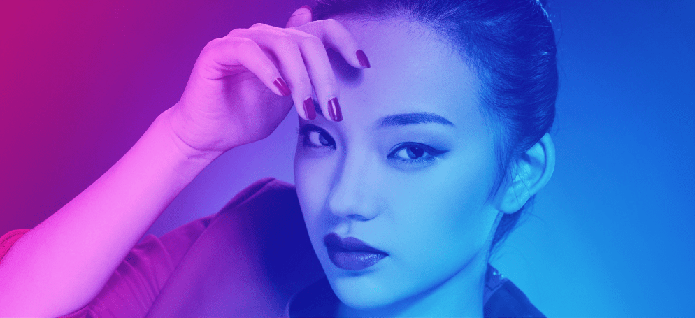 A close up shot of a Chinese model looking directly at the camera.