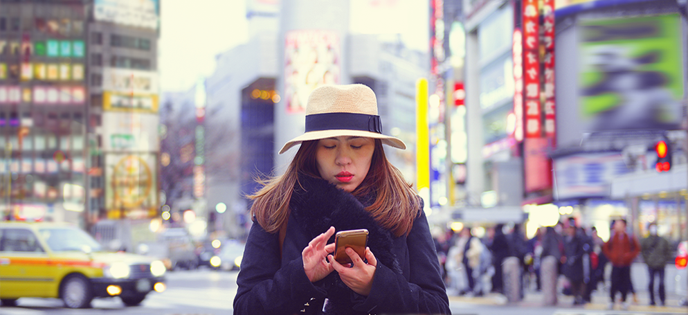 woman on phone in city