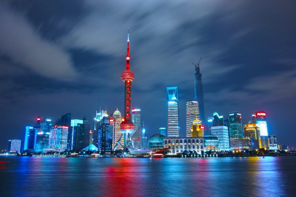 cityscape at night with river infront