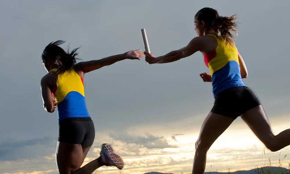 passing the baton in relay race
