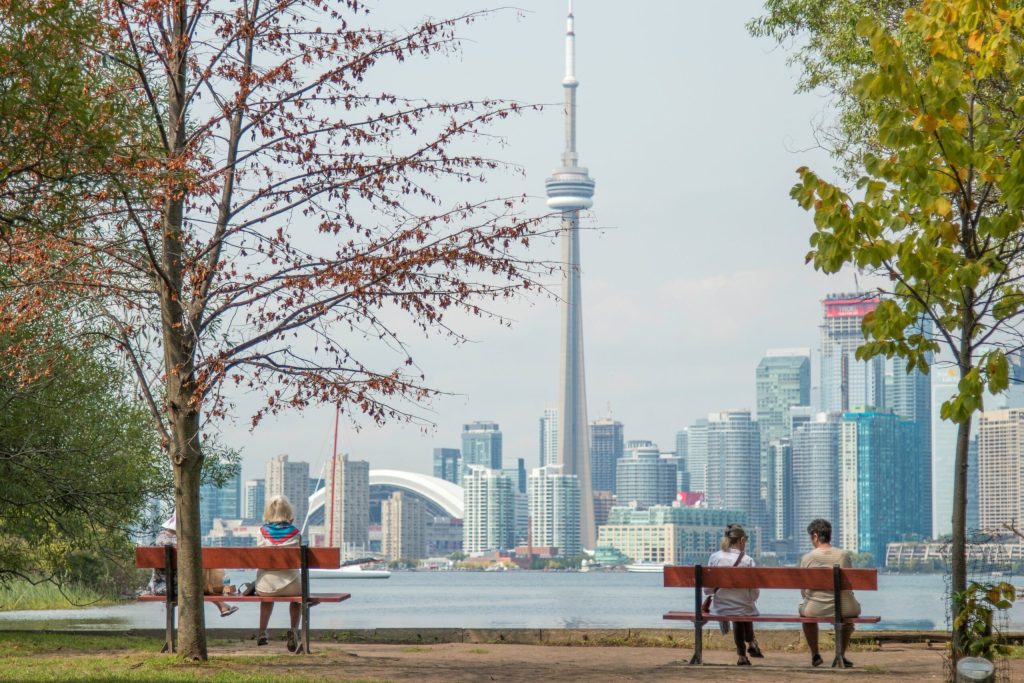 large cityscape and two people on bench
