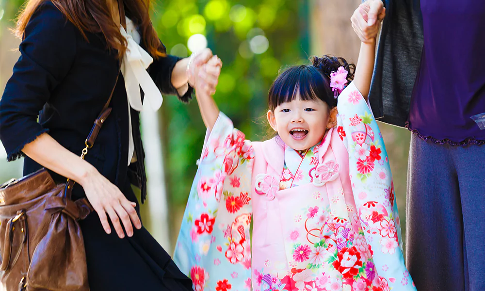 happy child holding parents hands