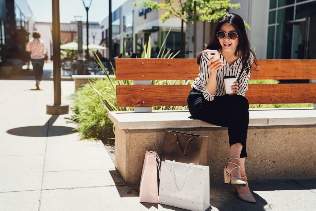woman sitting on bench on sunny day