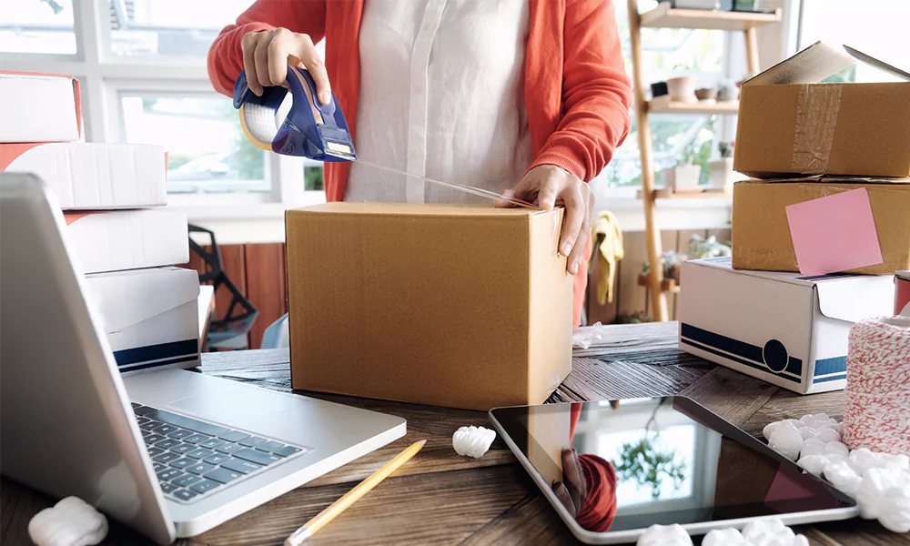 person packing a box