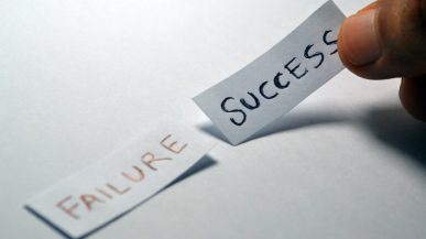 two pieces of paper with the words failure and success