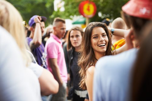 woman smiling in crowd