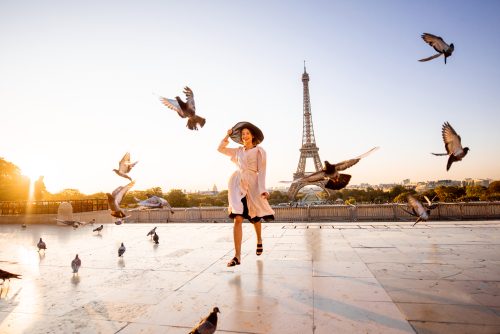 Woman on the square with beautiful view on the Eiffel tower in Paris