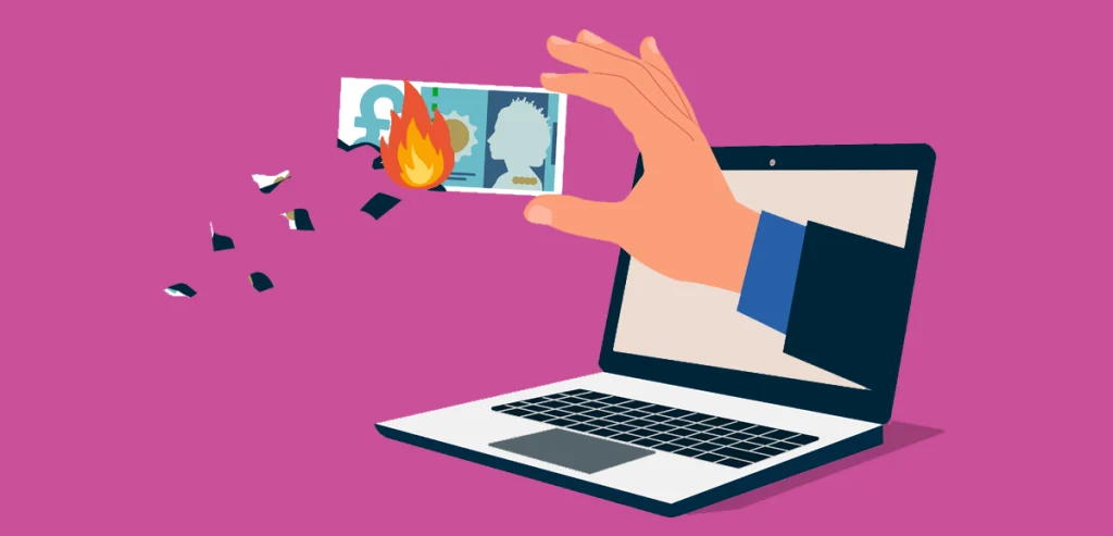 A cartoon hand holding a burning pound note through a laptop screen