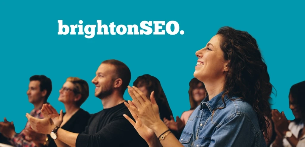Audience applauding with BrightonSEO logo in the background