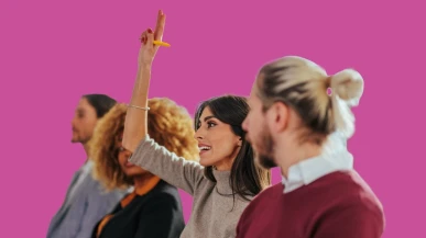 Group of clients with one raising her hand to ask a question